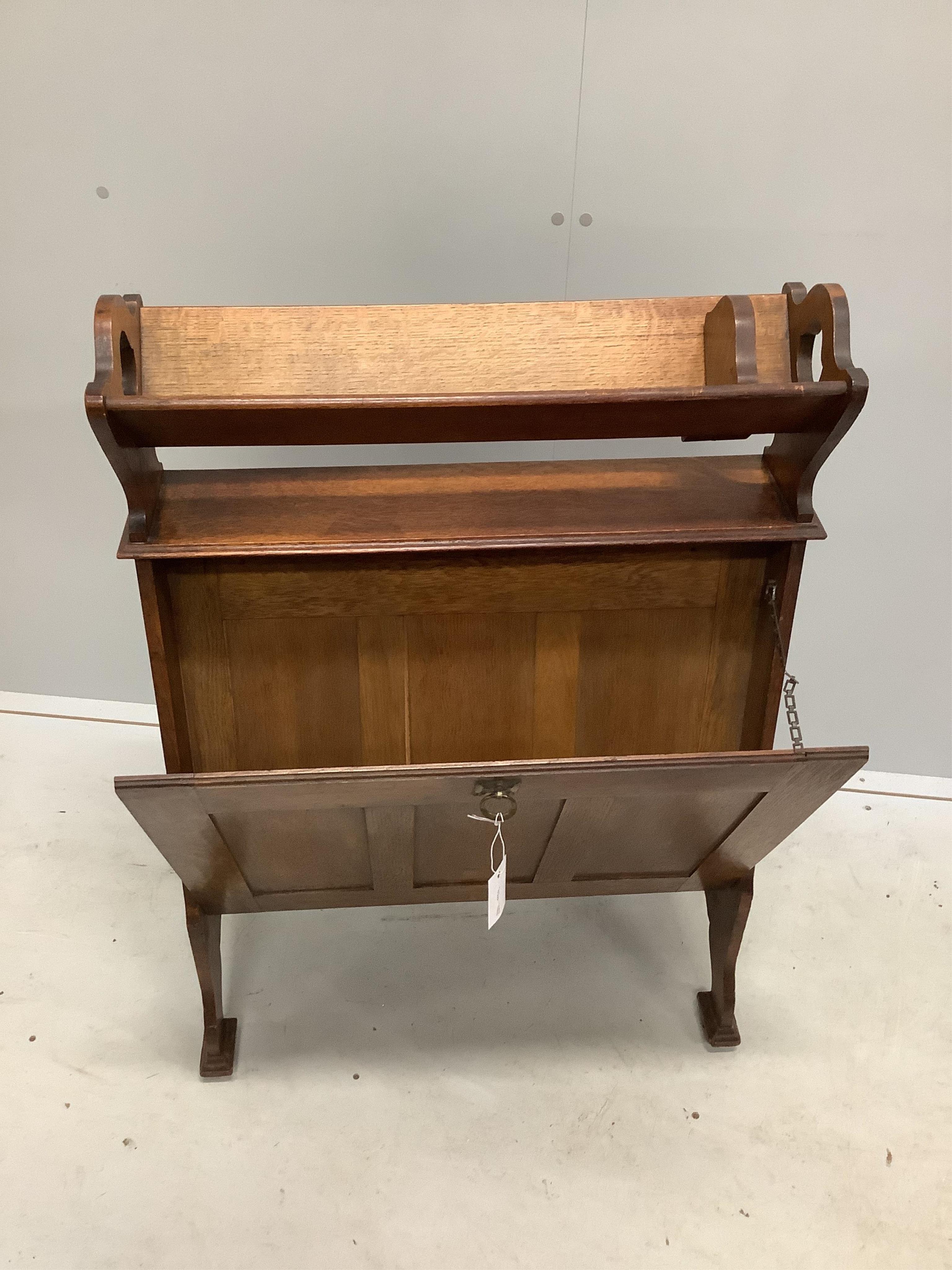 An Arts & Crafts oak folio stand/bookcase, width 70cm, height 96cm. Condition - fair to good